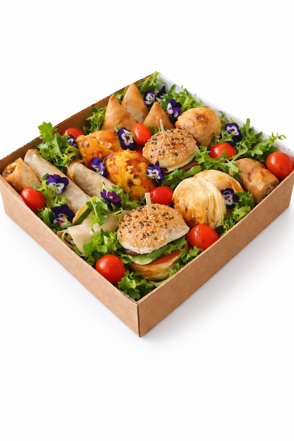 The Sample Box: bakery rolls and pastries over leafy greens with cherry tomatoes