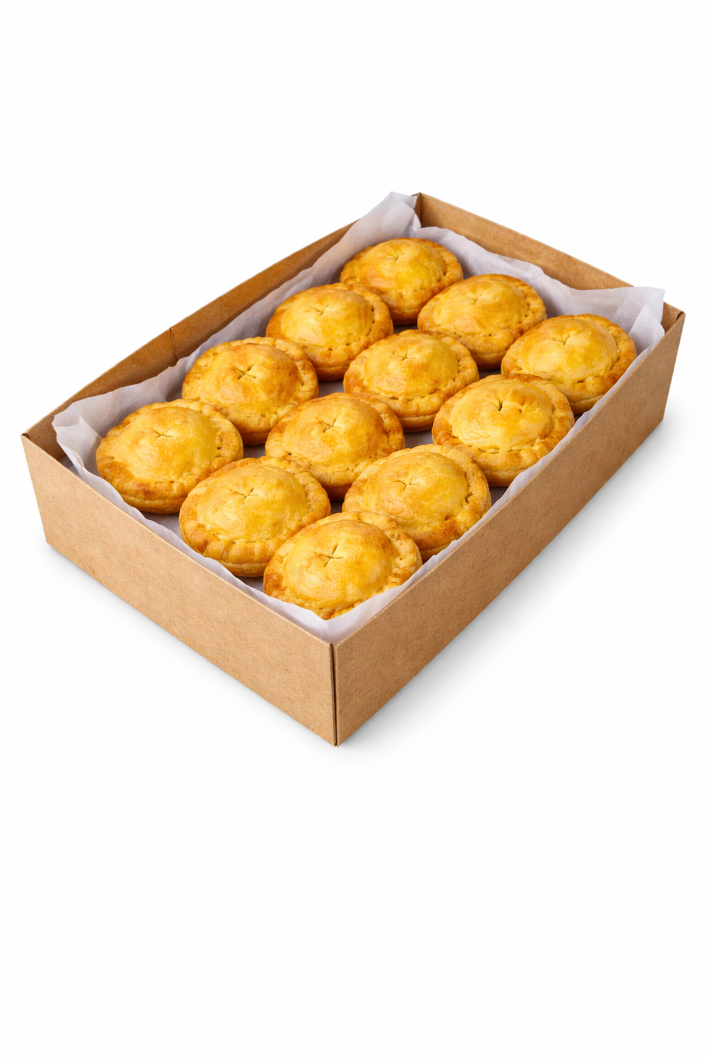 Baked pies in a cardboard box lined with paper, golden pastry bites